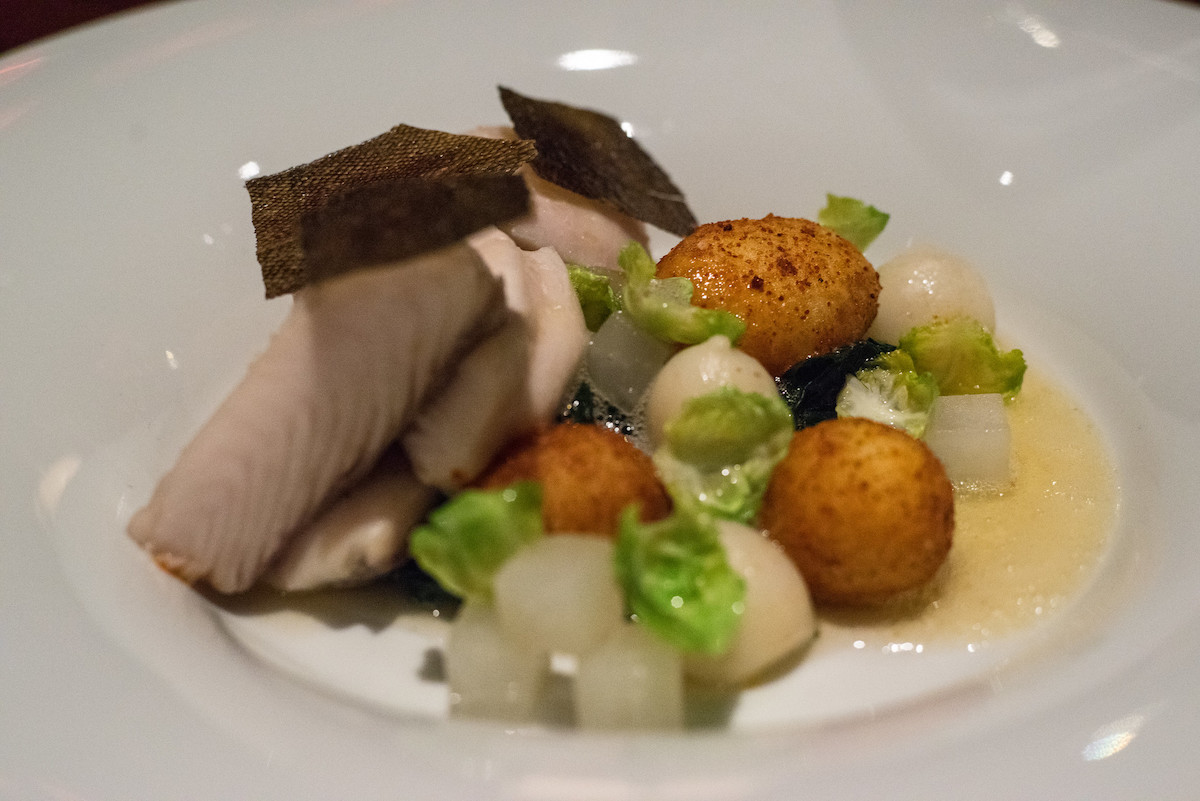 Close up of a dish with black cod, turnips, and potatoes at Aziza, a popular San Francisco restaurant