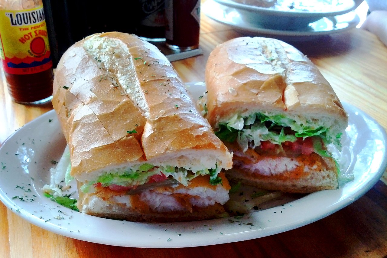 poboy sandwich of white bread fired fish and lettuce 