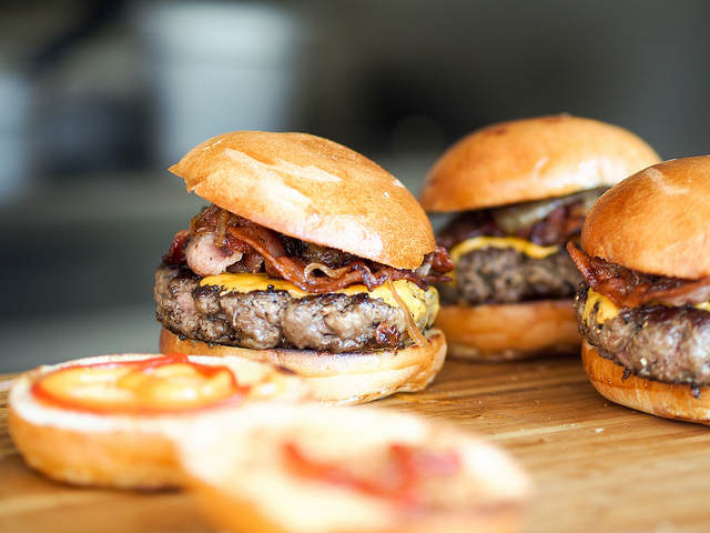 This burger is fully loaded with cheddar cheese and crispy fried bacon.