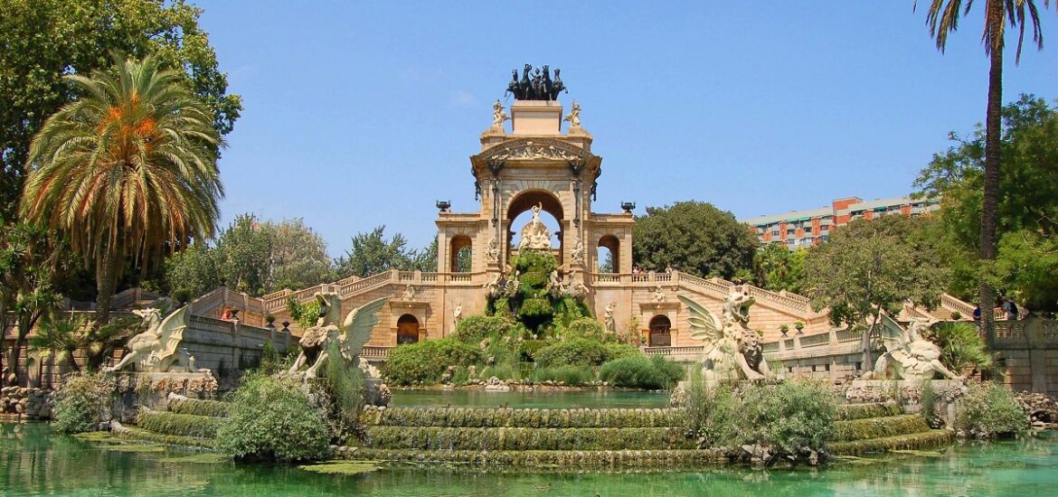 Ornate fountain surrounded by water on a warm spring day in Barcelona's Parc de la Ciutadella