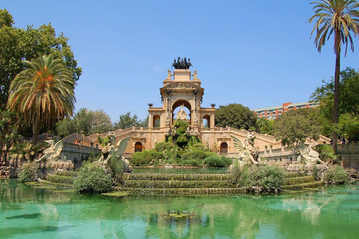 Beautiful ornate fountain surrounded by water on a warm spring day in Barcelona's Parc de la Ciutadella