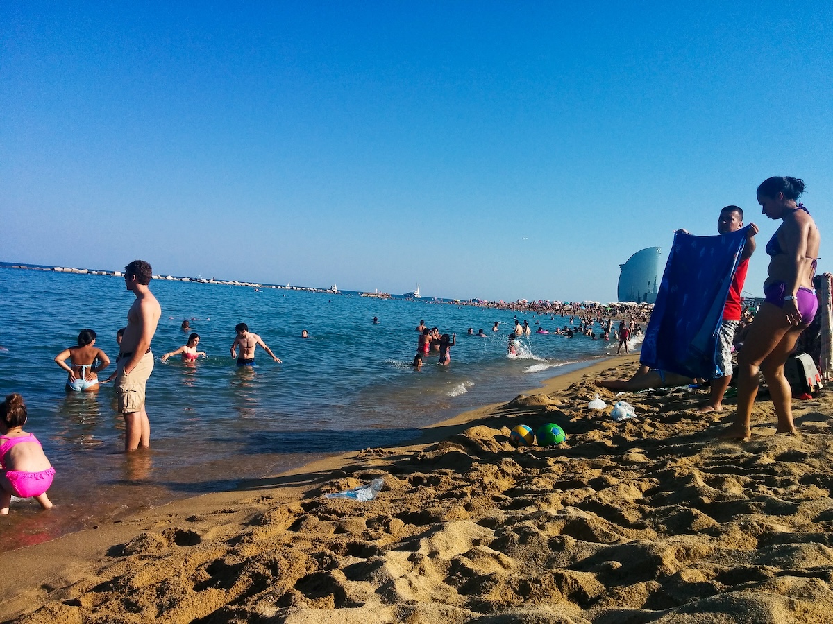 people swimming on the beach in Barcelona