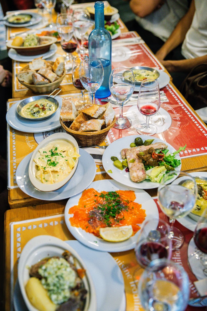 Restaurant table full of delicious and varied plates of food