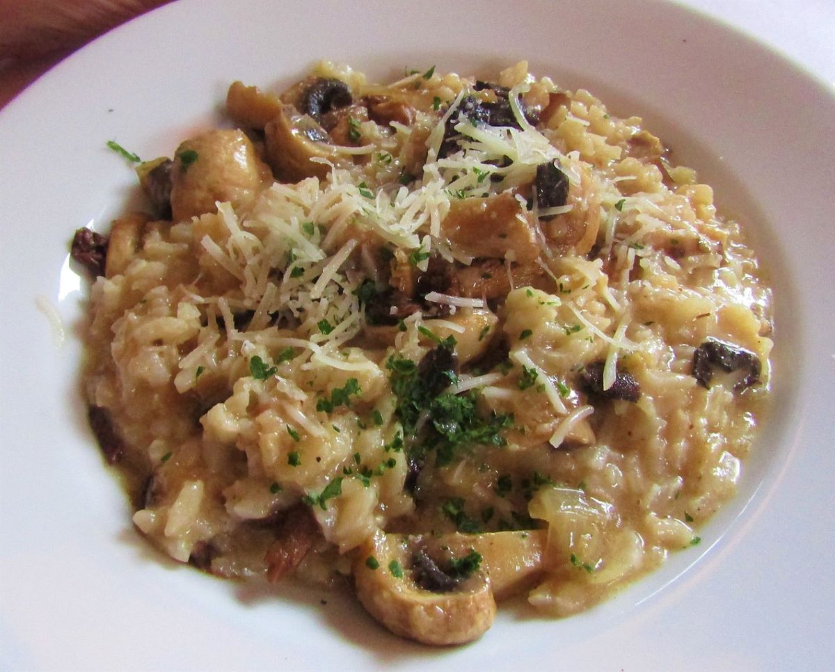 mushroom risotto with onion and hebs
