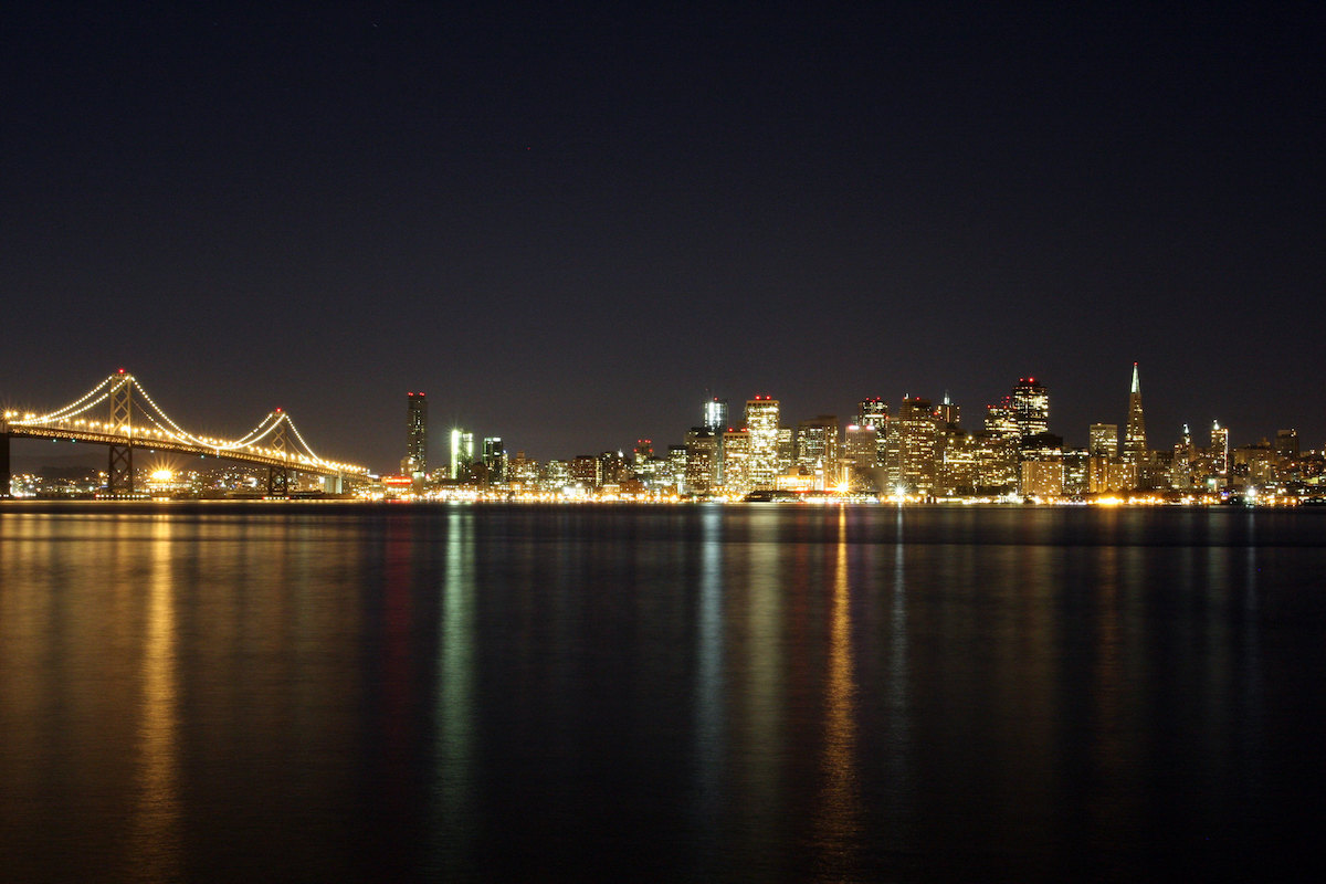Nighttime view of the San Francisco skyline and Bay Bridge