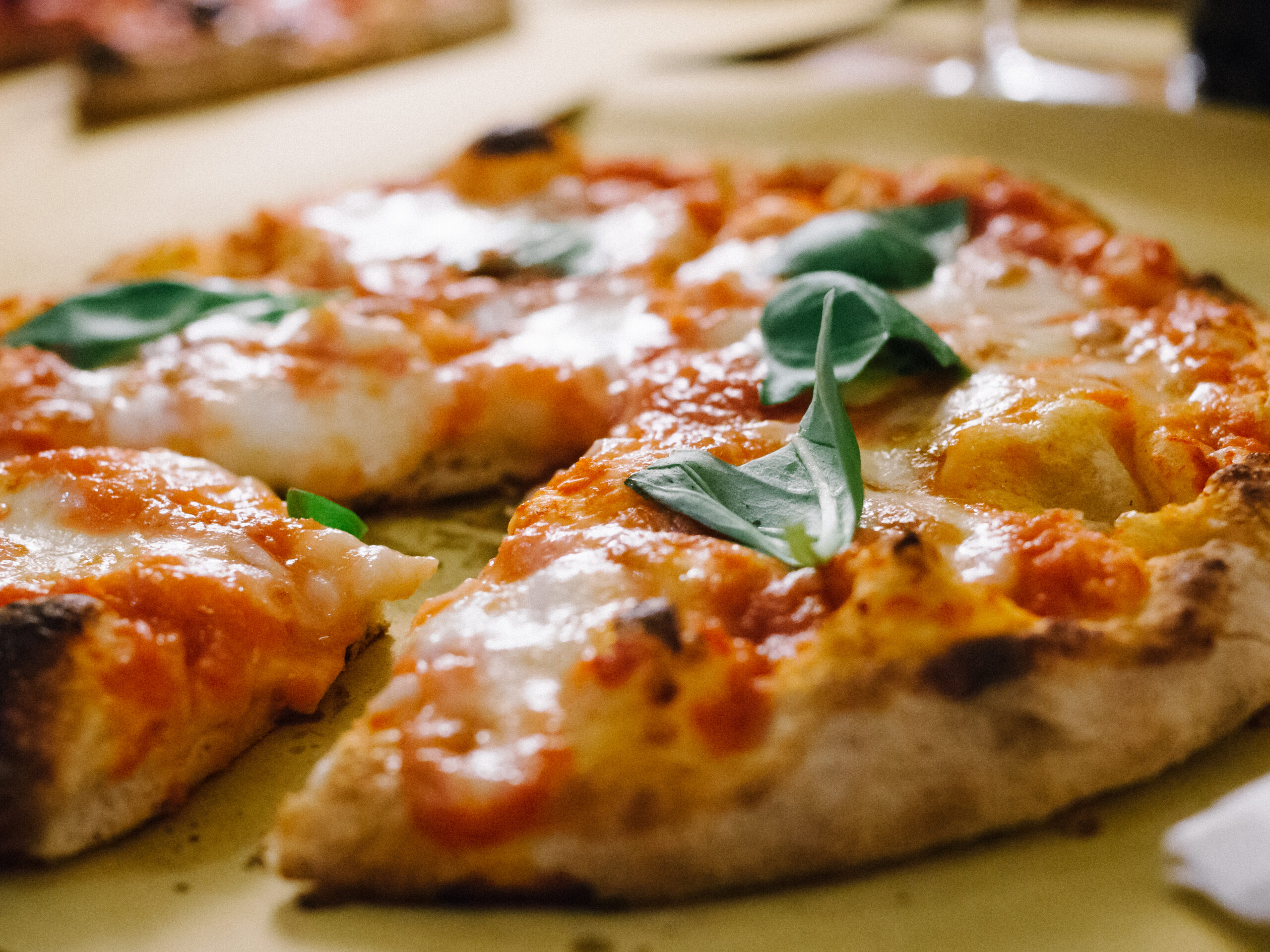 Stonebaked pizza garnished with basil