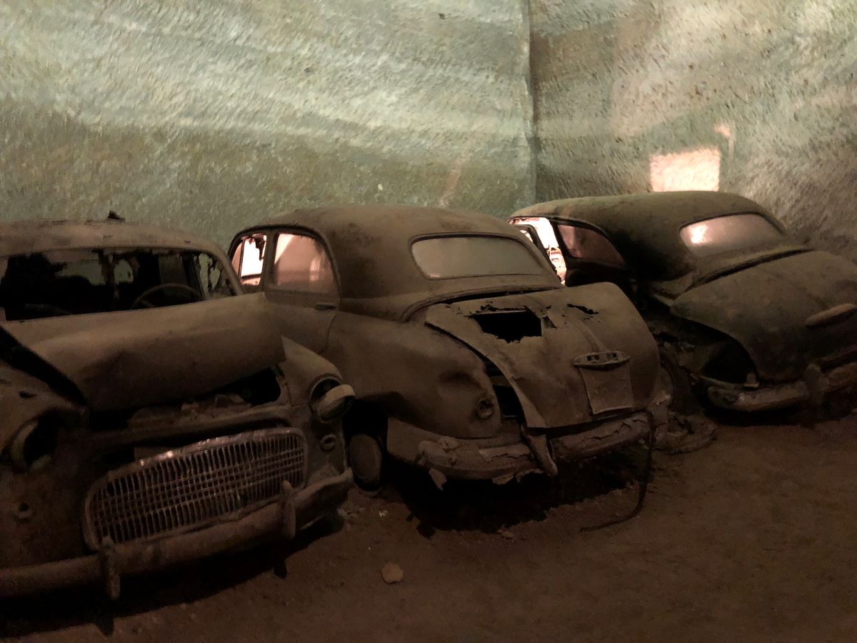 Old broken cars covered in dust
