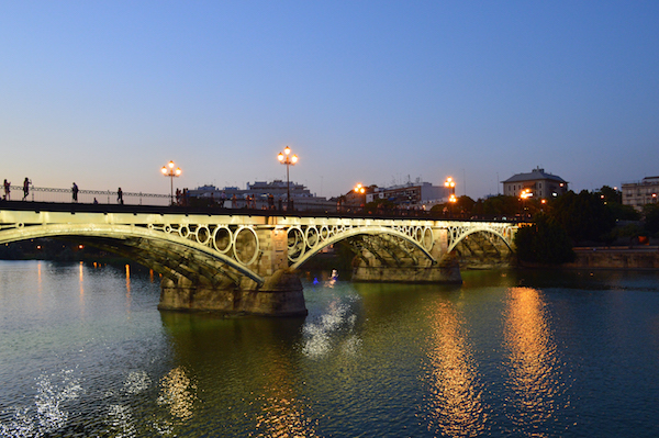 Love is in the air! One of the most romantic things to do in Seville in February is to take a stroll with your special someone over the gorgeous Triana Bridge.