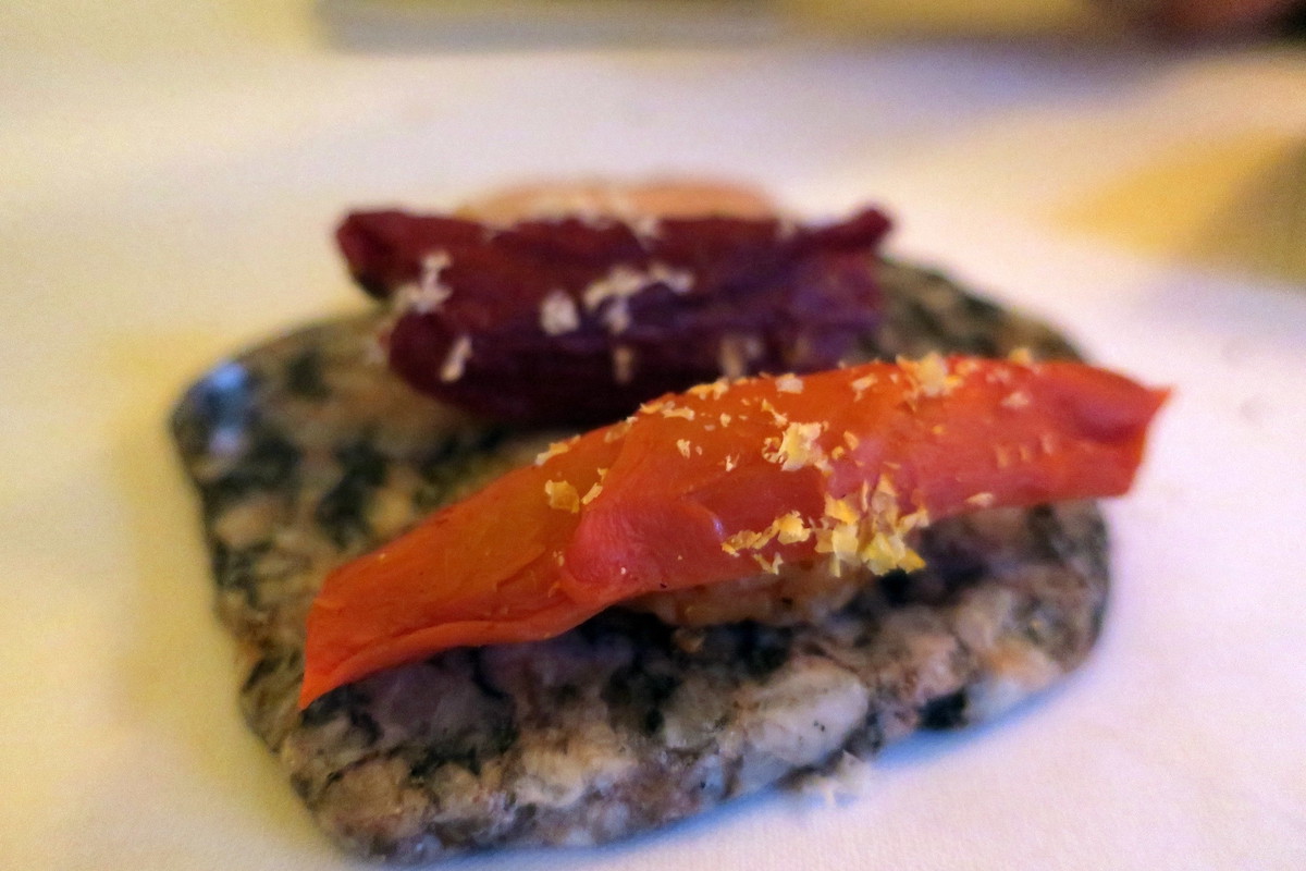 extreme close up of a carrot and tomato sushi dish at Blue Hill at Stone Barns, an eatery just outside of NYC