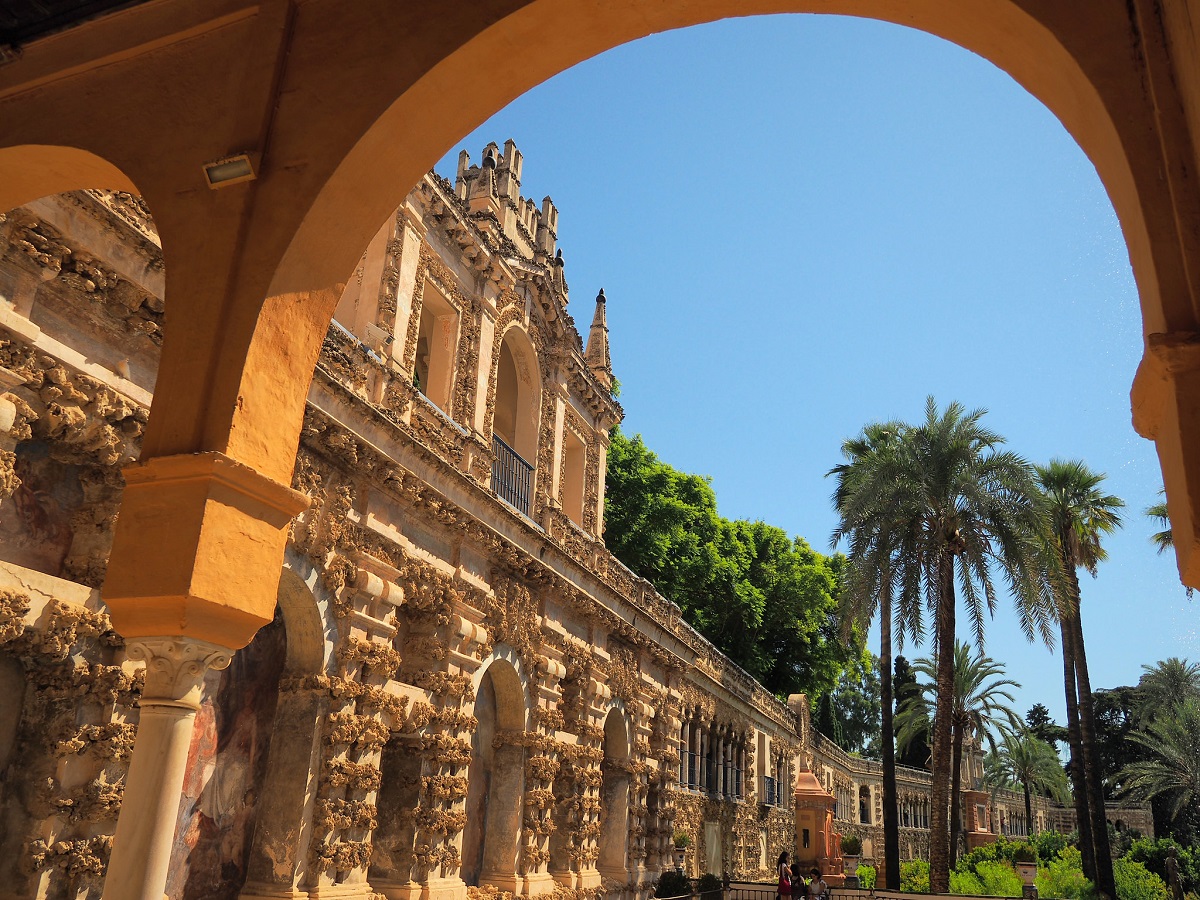 View out to the gardens from beneath the awning of Royal Alcázar of Seville