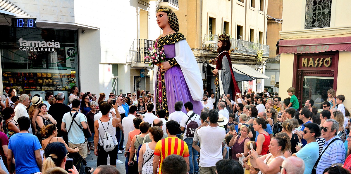 Gegants, or giant figures, parade through a crowd in Catalunya