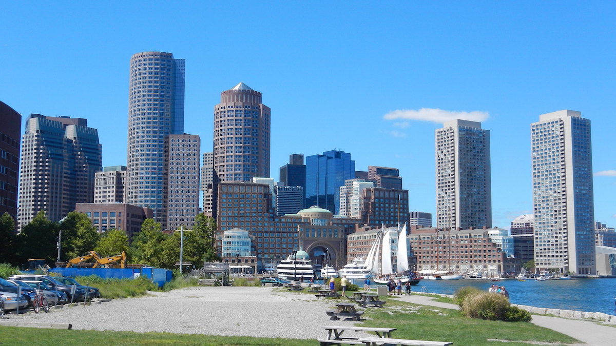 The Boston skyline towers in the background from the view of Fan Pier Park.