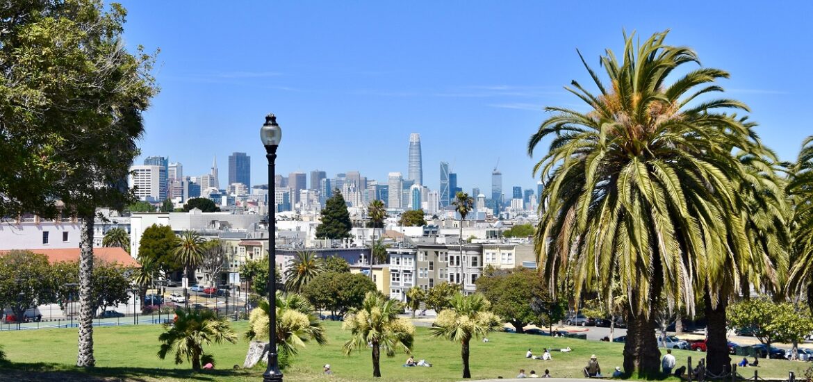 Mission Dolores Park in san francisco on a sunny day with lamps and trees