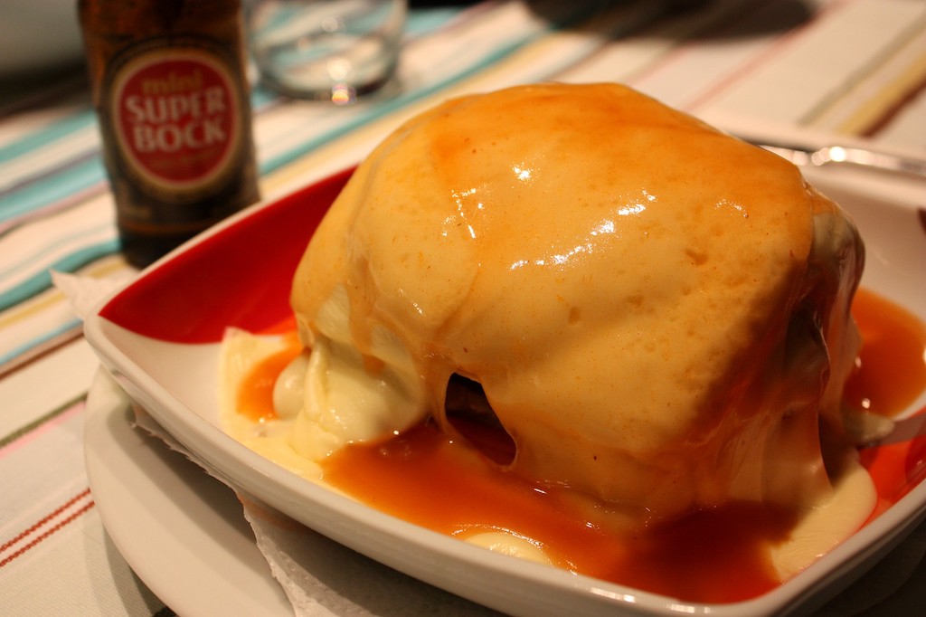 francesinha with meat and cheese at a restaurant in Portugal