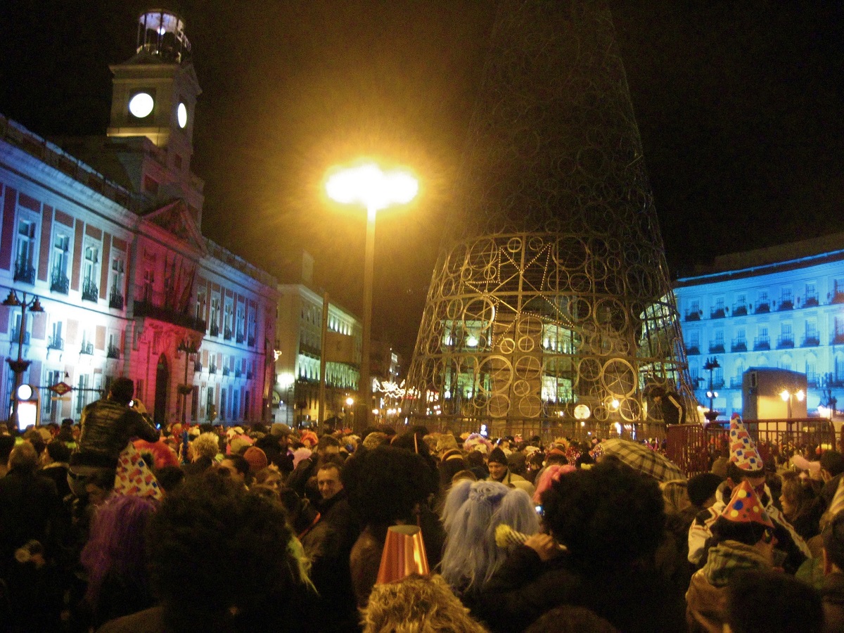 Revelers in Puerta del Sol eagerly count down to midnight on New Year's Eve