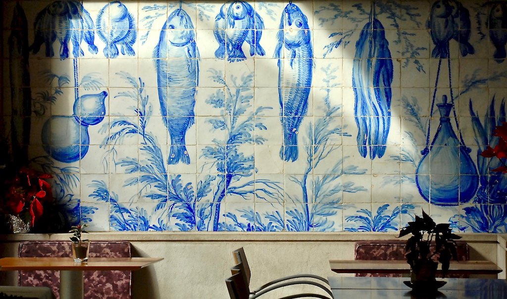 Blue ceramic tiles with fish on a wall at the Museu Nacional do Azulejo in Lisbon, Portugal