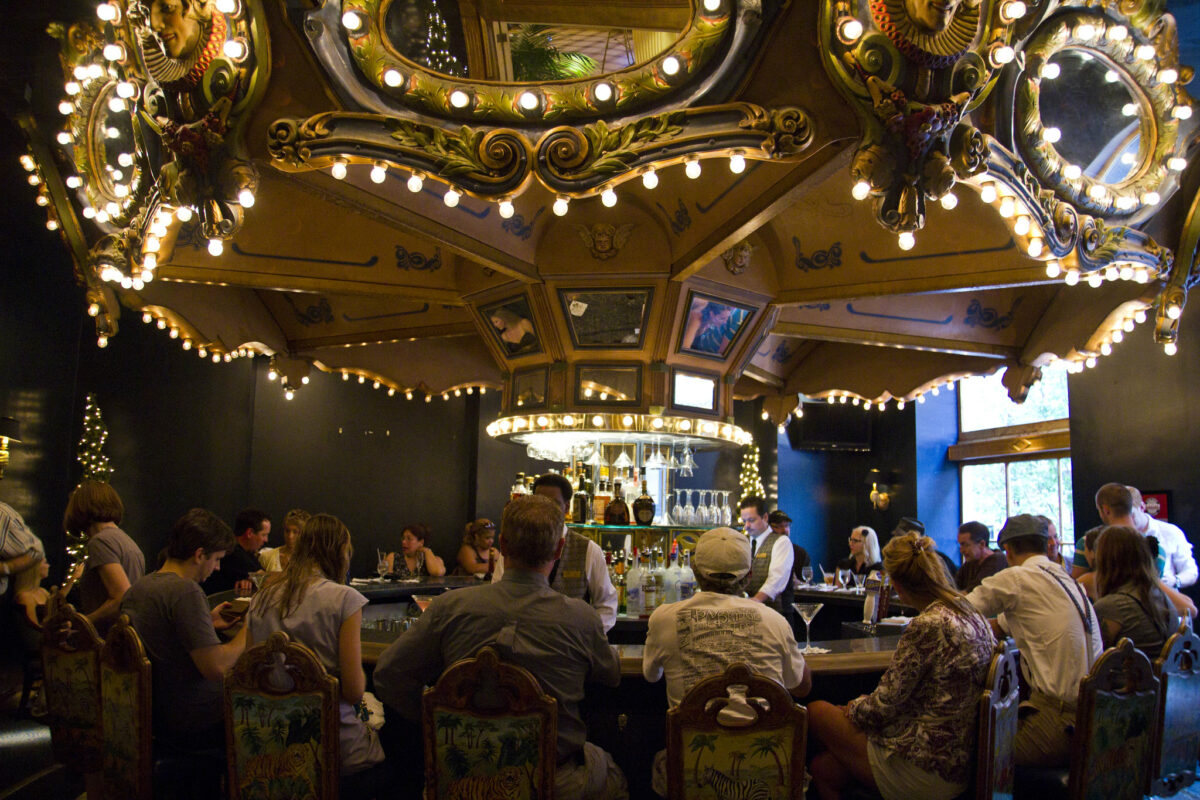 people seating around a carrousel bar