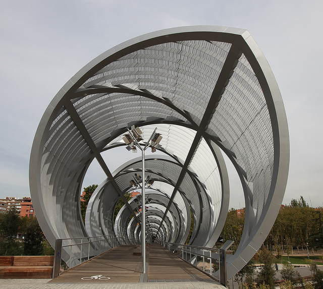 Arganzuela footbridge over the Madrid Río, with its unique circular appearance makes it one of the more interesting places to go for a jog in Madrid