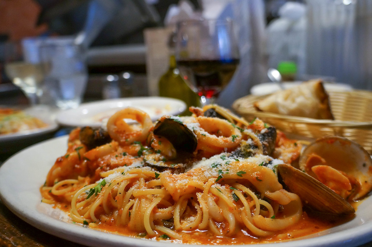 Close up of a plate of frutti di mare, a spaghetti dish with clams and seafood, a Giacomo's in Boston