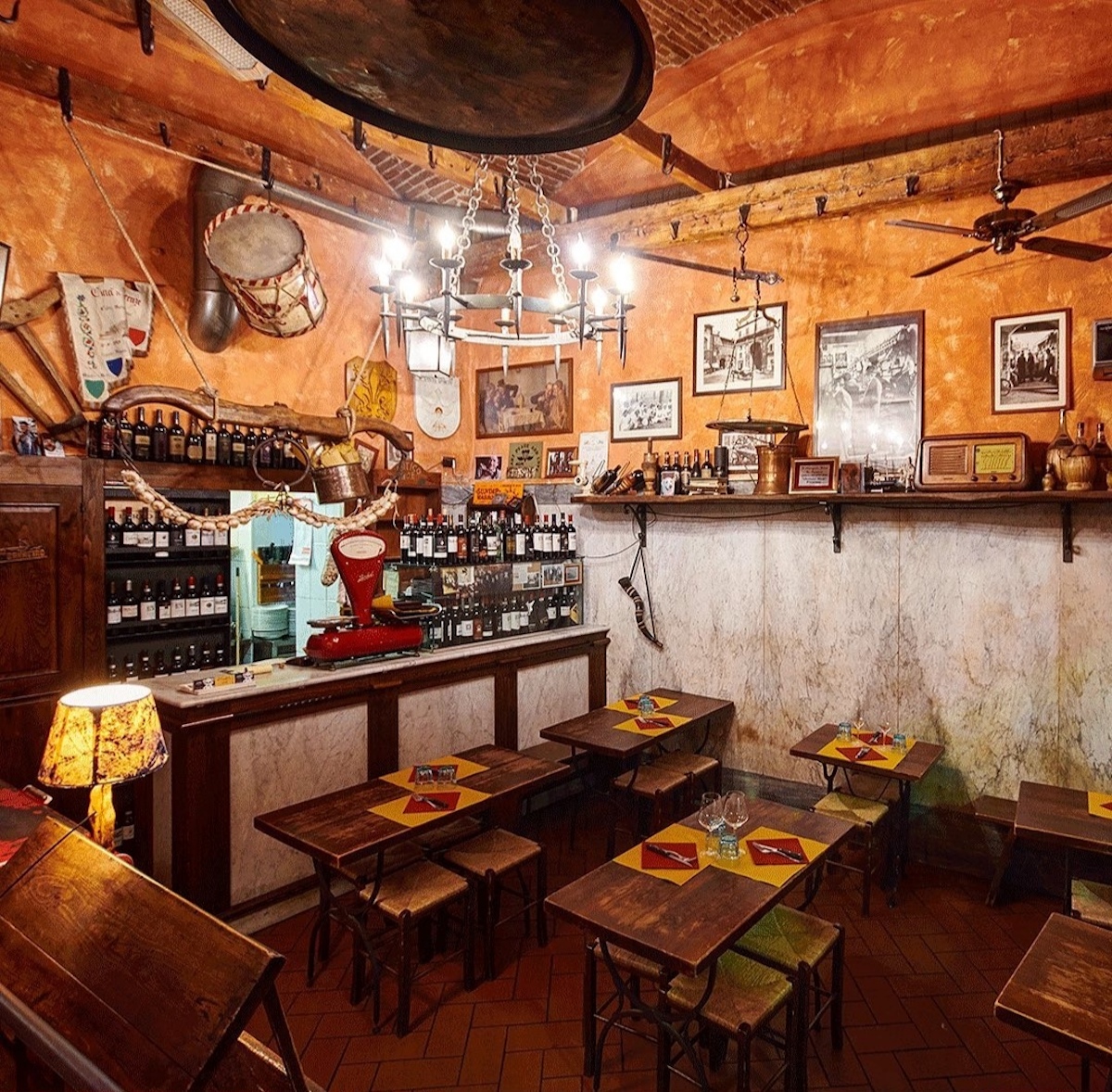 Interior of a rustic Tuscan restaurant with dark wood paneling