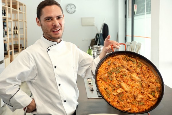 Cooking classes in Seville are a lot of fun! This is Victor with the paella that we made together at Taller Andaluz de Cocina.