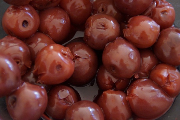 Fermented cherries are commonly served with ginja in Lisbon.