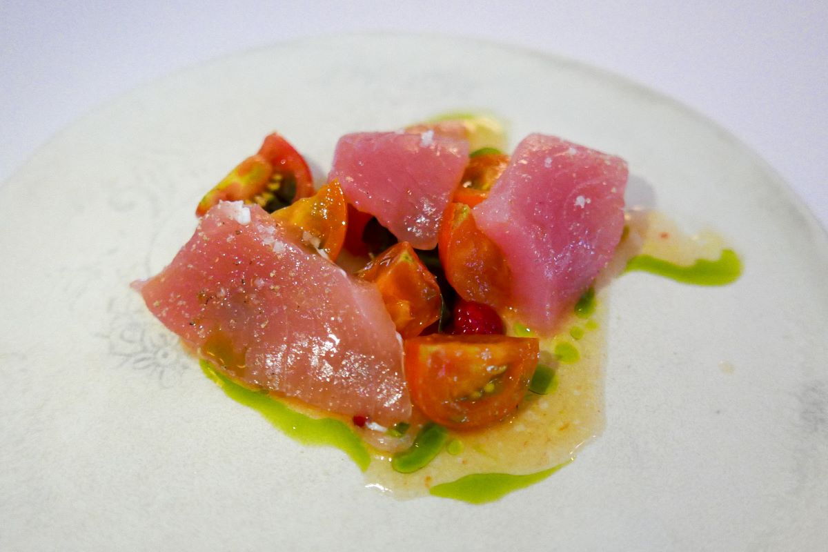 close-up of tuna and cherry tomatoes in oil made by New York's best chef.