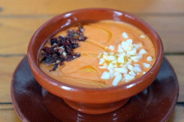 When talking about the best traditional tapas in Seville, you can't forget amazing salmorejo, sprinkled with ham and boiled egg