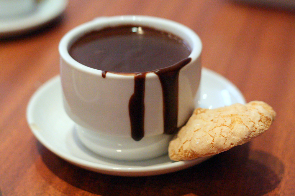 Kids absolutely love Spanish hot chocolate! Read about eating with kids in Barcelona on our blog!