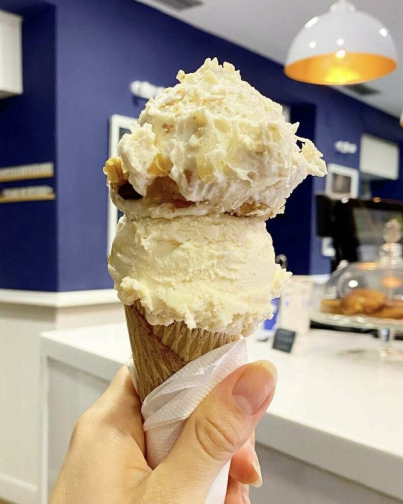 Two scoops of ice cream in a cone