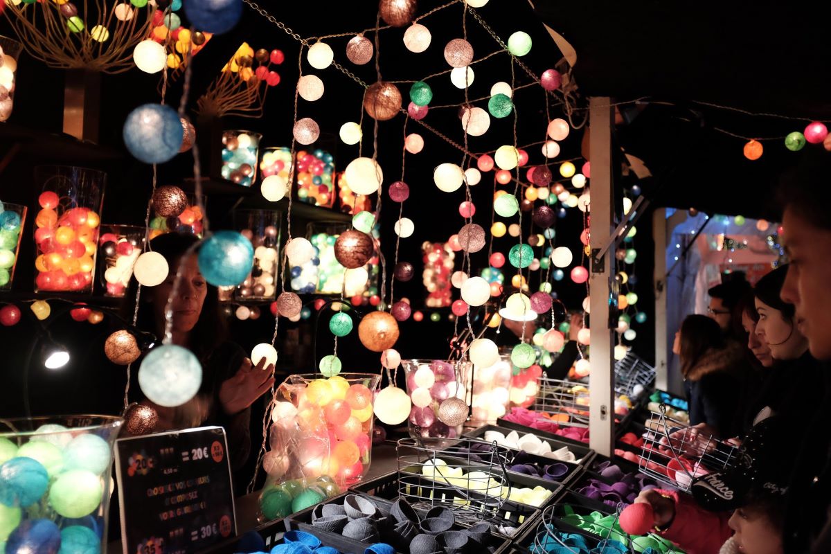 Glowing lights being sold at Christmas market in Paris.