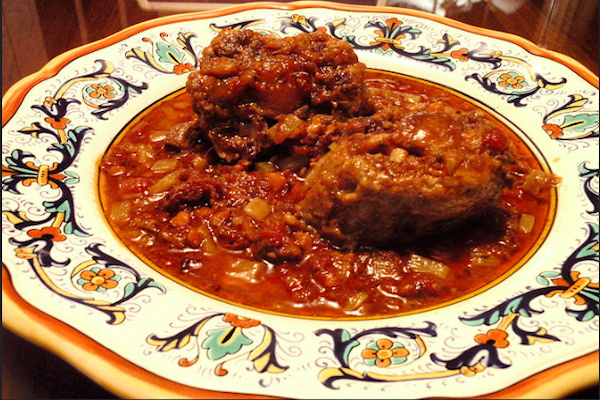 Coda alla Vaccinara is a classic Roman dish of oxtails in tomato sauce with celery