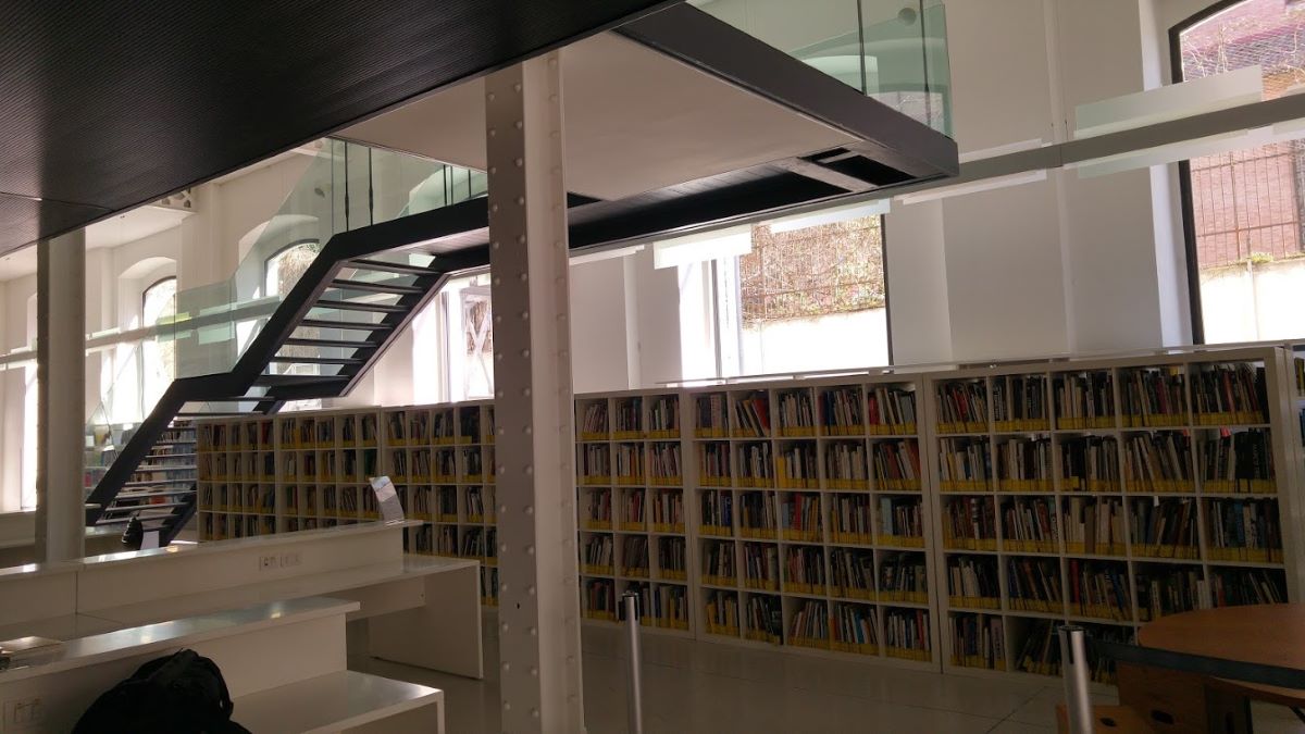library with windows and black stairs
