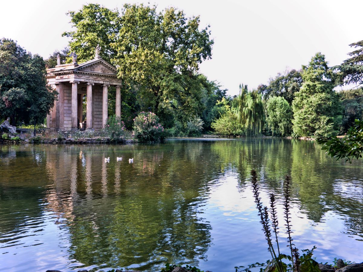 water surrounding a mote in Villa Borghese gardens in Rome.