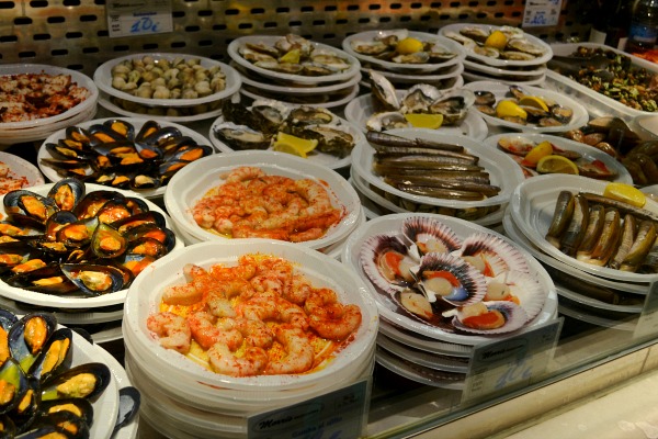 oysters, prawns, sardines - just some o the beautiful produce available at the markets in Madrid, sampling these inside the market is a unique way of spending time with your loved one in Madrid