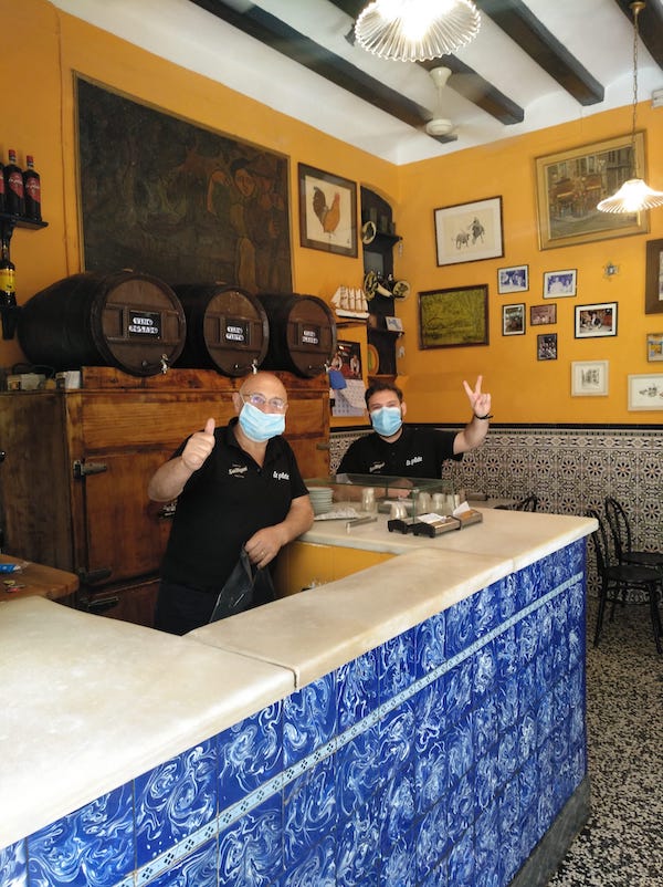 Bar staff in Spain wearing face masks for health and safety