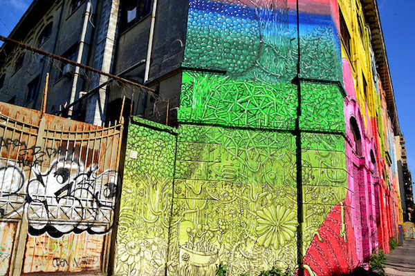 Brightly colored street art in Ostiense district is one of the greatest treasures in Rome off the beaten track.