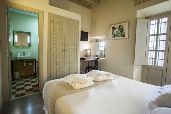 The Casa de Santa Cruz has these beautiful rooms, making it a wonderful option if you are looking to stay in a boutique hotel in Seville. Check our Ultimate travel guide to seville for more great recommendations!