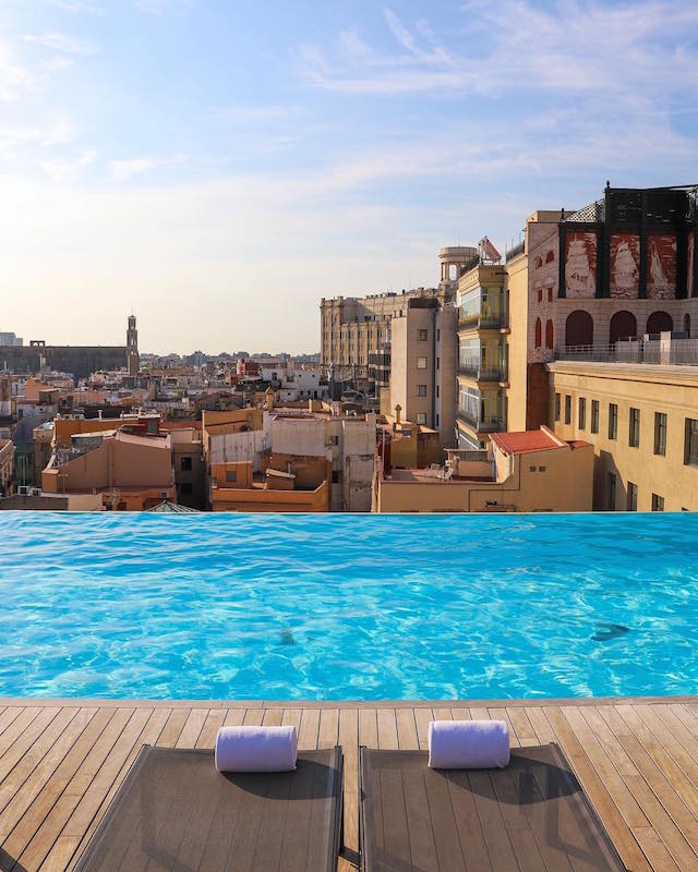 One of our top picks for rooftop pools in Barcelona is definitely the Skybar atop Grand Hotel Central. Just look at those views!
