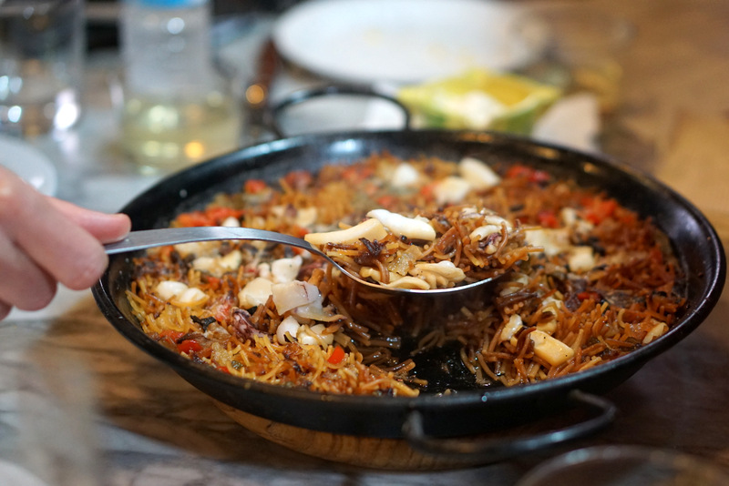 Wondering what to eat in Barcelona? Try Amazing fideua, the cousin of paella in Barcelona, on our Tastes, Tapas and Traditions of Barcelona food tour! It's a must to find out all of the great foods to try while here! This is a top tip for travel guide to Barcelona!