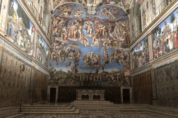 Pictured here is an inside view of the Sistine Chapel, and one of our top travel tips for Rome is to visit it early.
