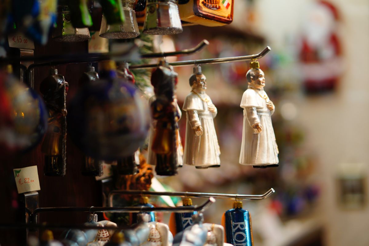 Close up of figurines hanging from it's sides at a Christmas market in Rome. 