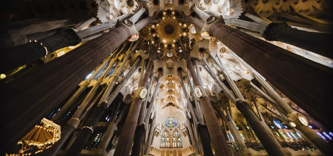 Lighted ceiling of the Sagrada Familia on a dark day in Barcelona