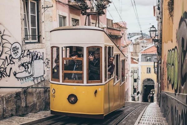 Riding an iconic yellow tram is one of the most popular things to do in Lisbon.