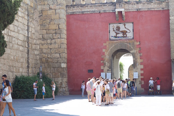 One of our top tips in our guide to visiting the Alcazar in Seville: buy tickets online to avoid long queues!