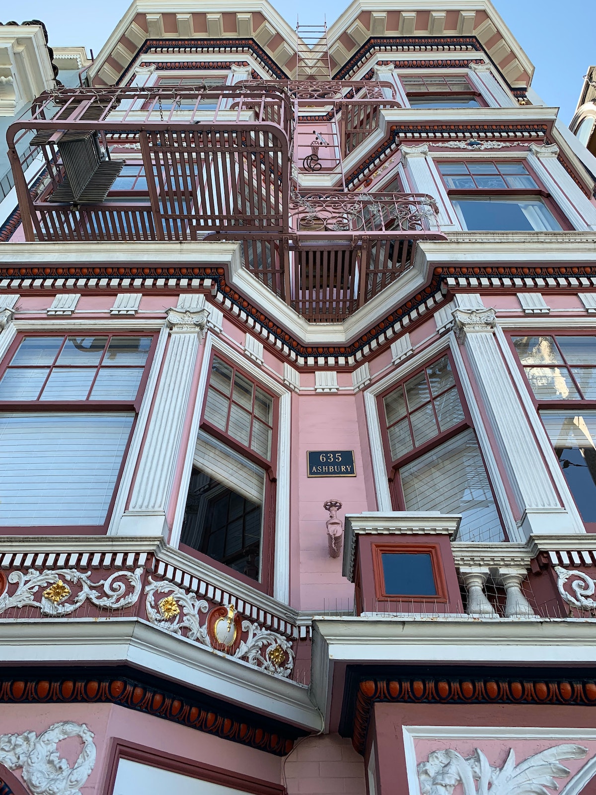 Architecture detail of the Janis Joplin house, a pink Victorian style architecture with intricate decoration