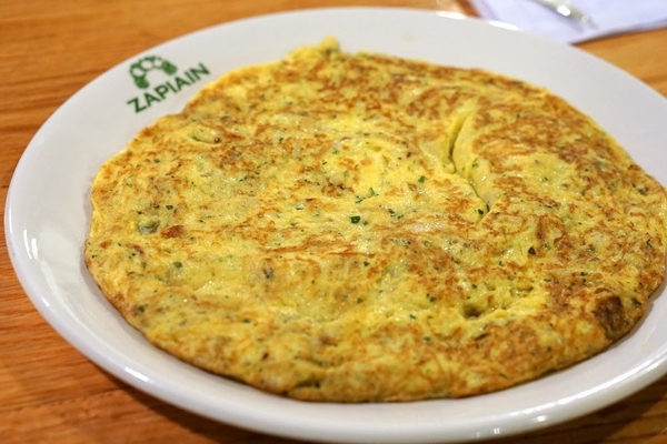 Tortilla de bacalao is one of the typical dishes found at Basque cider houses.