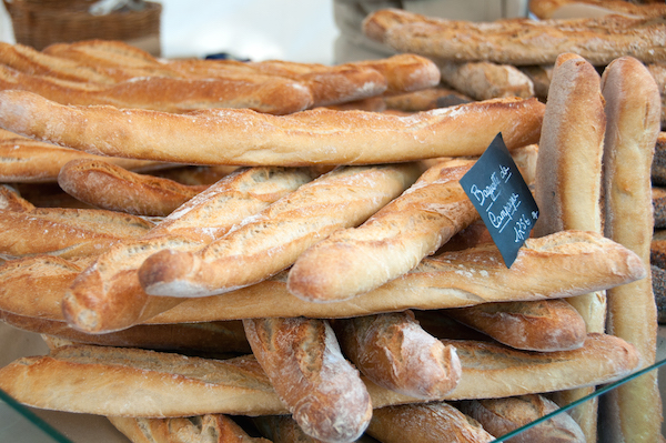 Not sure how to identify a good baguette? The best baguettes in Paris are artisanal, homemade, and don't come from a factory. These perfectly golden loaves look authentic to us!