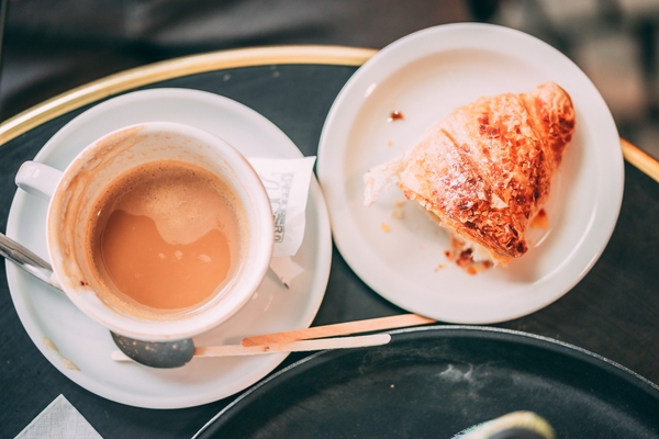 The best coffee in Paris comes with a pastry on the side.