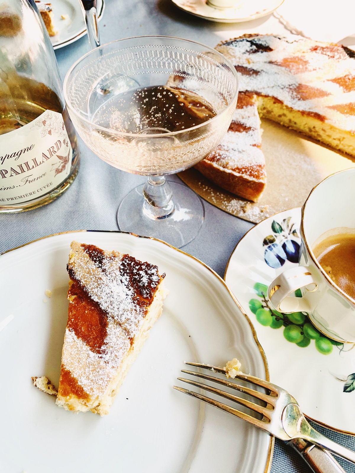 Dessert spread with sparkling wine, tea, and apricot tart